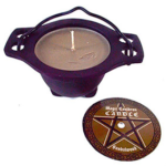 Sandalwood candle in cauldron